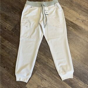 New jogger scrub pant. Never worn but sat in laundry basket. As is.